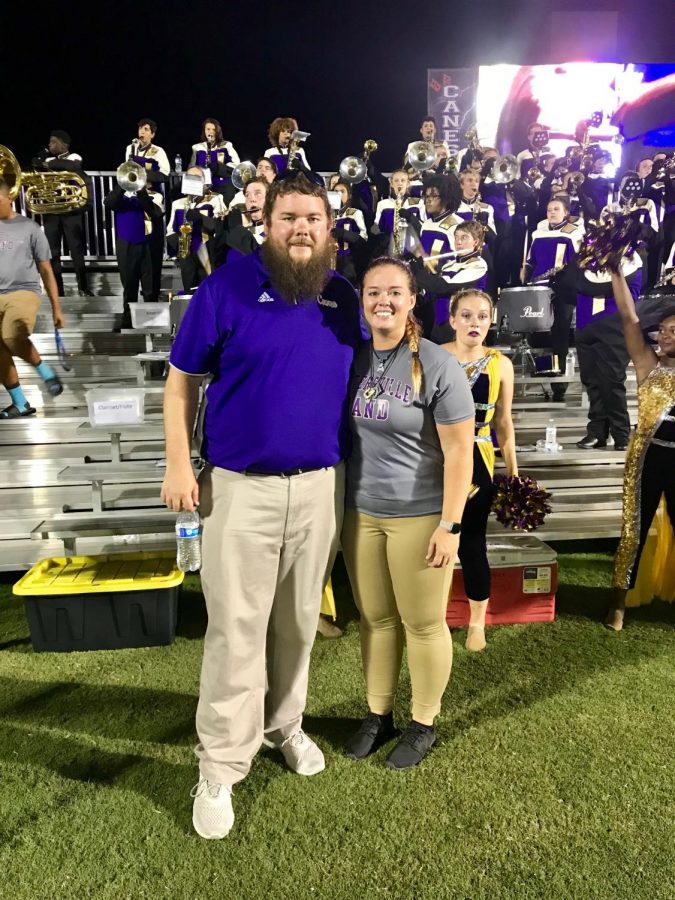 Mr. Shive, left, and Ms. Lanier, right, pose in front of the band.