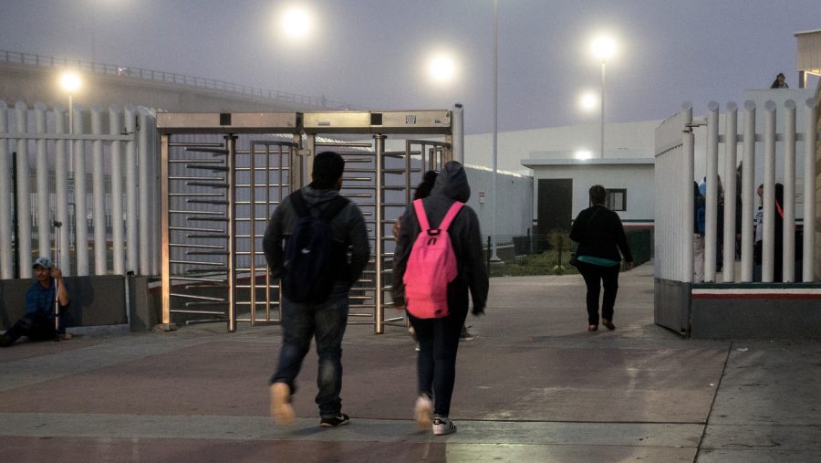 Students in Tijuana walk toward the U.S. border early in the morning on May 2. Teachers in San Diego estimate that about 1,000 students cross from Tijuana into San Diego every day to go to school.