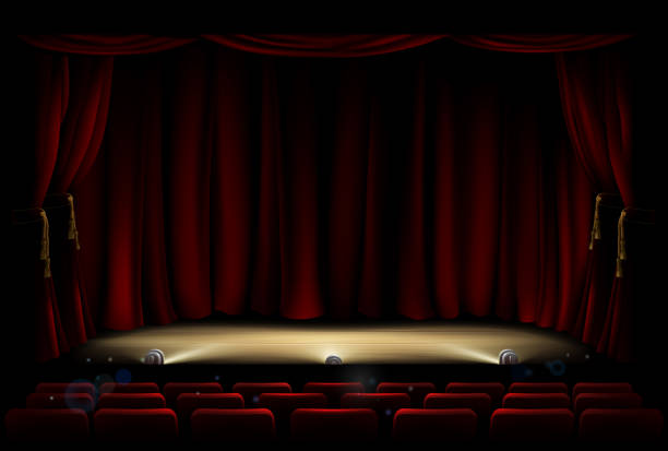 An+illustration+of+a+theatre+or+theater+stage+and+seating+with+footlights+and+red+curtains